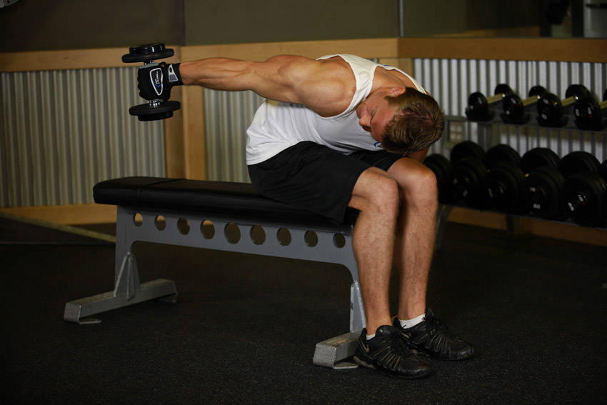 Alternative demonstration of Seated Bent-Over One-Arm Dumbbell Triceps Extension exercise