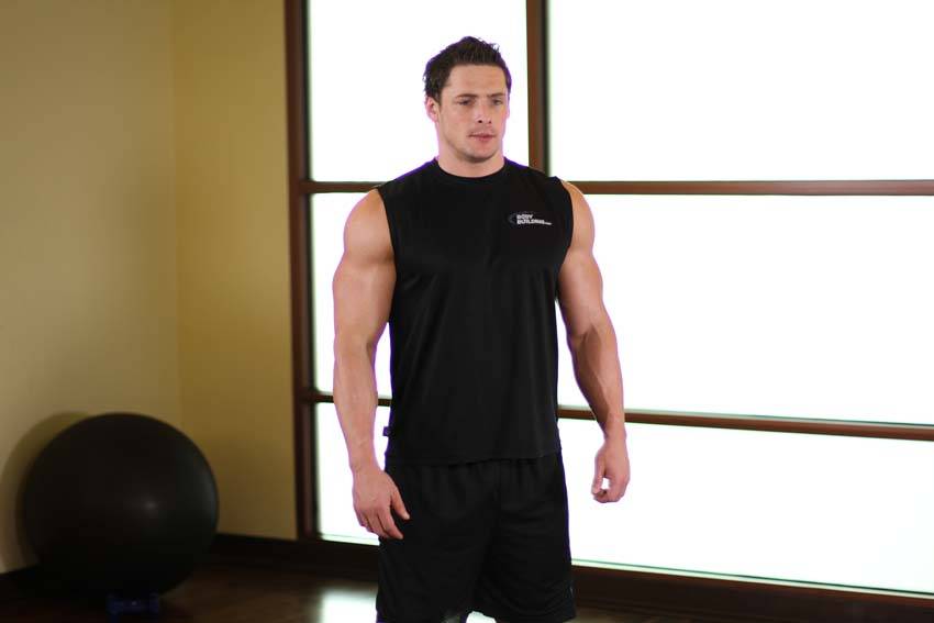 Demonstration of Shoulder Raise exercise showing proper form and technique