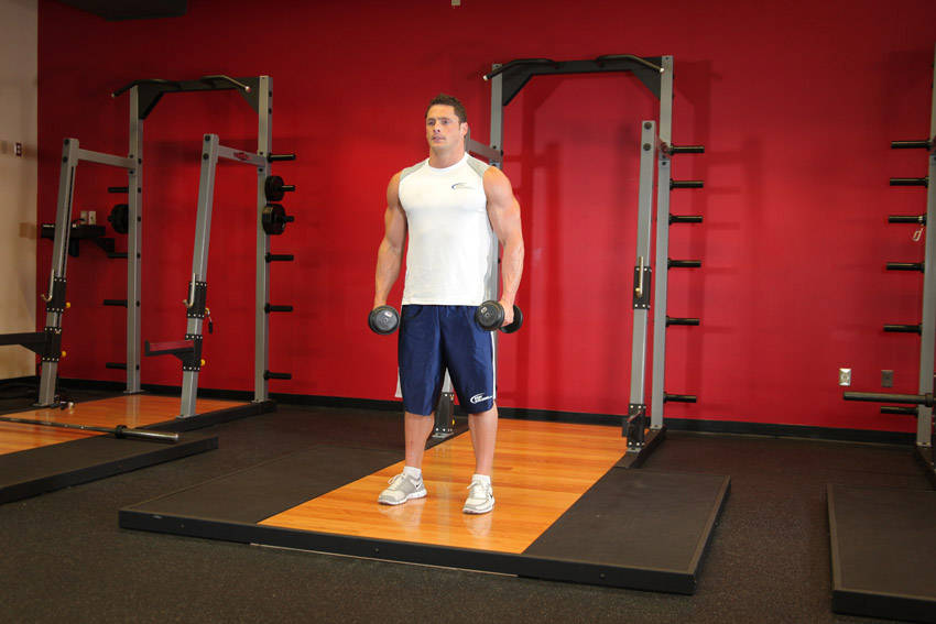 Demonstration of Side Lateral Raise exercise showing proper form and technique