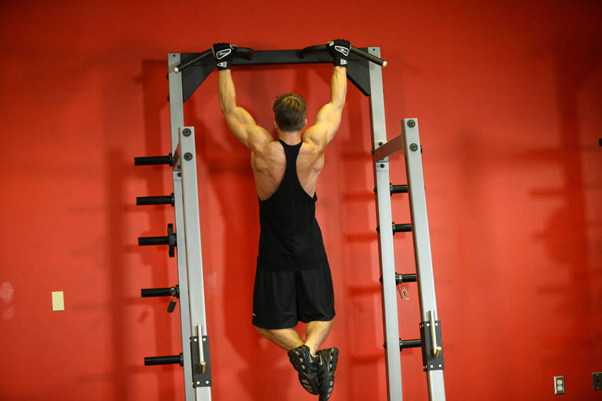 Demonstration of Side To Side Chins exercise showing proper form and technique