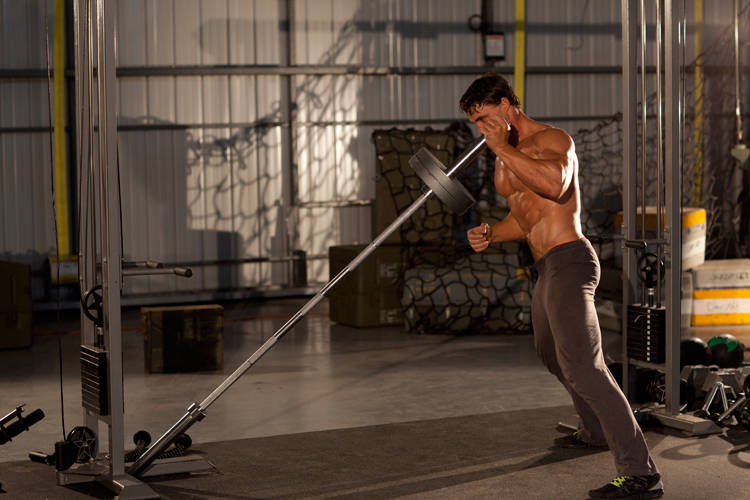 Demonstration of Single-Arm Linear Jammer exercise showing proper form and technique
