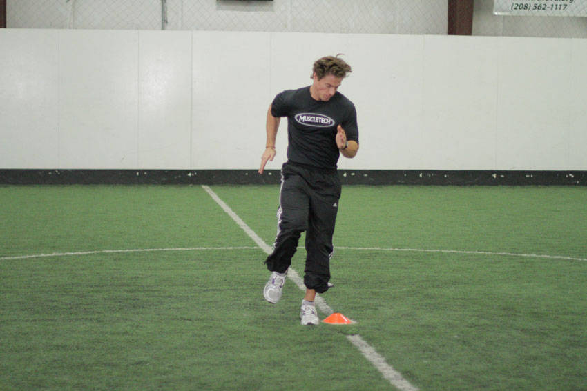 Demonstration of Single-Cone Sprint Drill exercise showing proper form and technique
