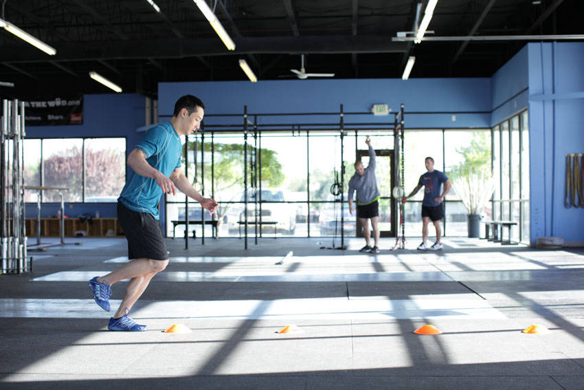 Demonstration of Single-Leg Hop Progression exercise showing proper form and technique