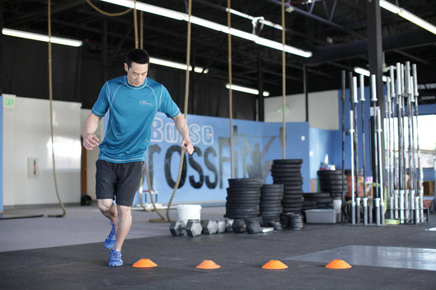 Demonstration of Single-Leg Lateral Hop exercise showing proper form and technique