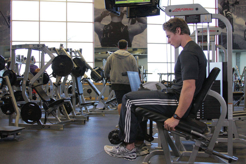 Demonstration of Single-Leg Leg Extension exercise showing proper form and technique