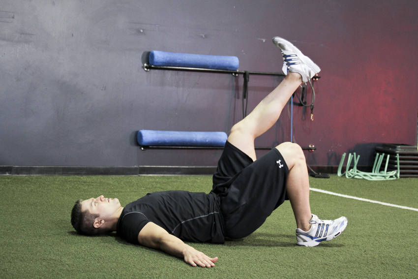 Demonstration of Single Leg Glute Bridge exercise showing proper form and technique