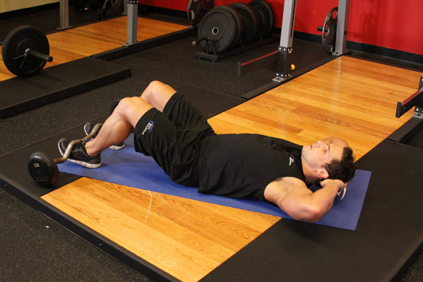 Demonstration of Sit-Up exercise showing proper form and technique