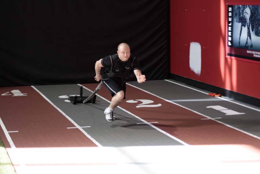 Demonstration of Sled Drag - Harness exercise showing proper form and technique