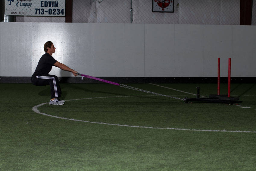 Demonstration of Sled Row exercise showing proper form and technique