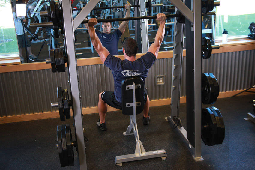 Alternative demonstration of Smith Machine Overhead Shoulder Press exercise