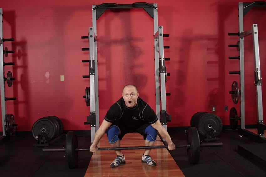 Demonstration of Snatch exercise showing proper form and technique