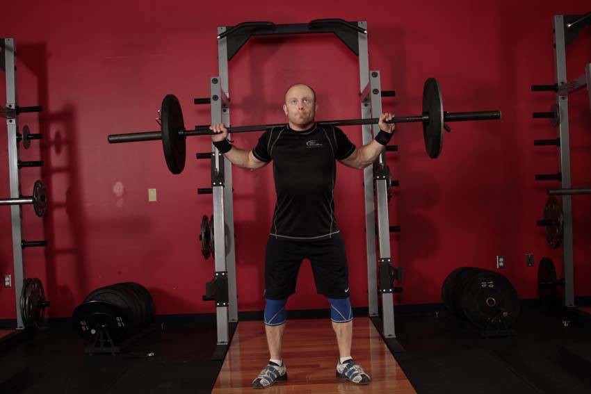 Demonstration of Snatch Balance exercise showing proper form and technique