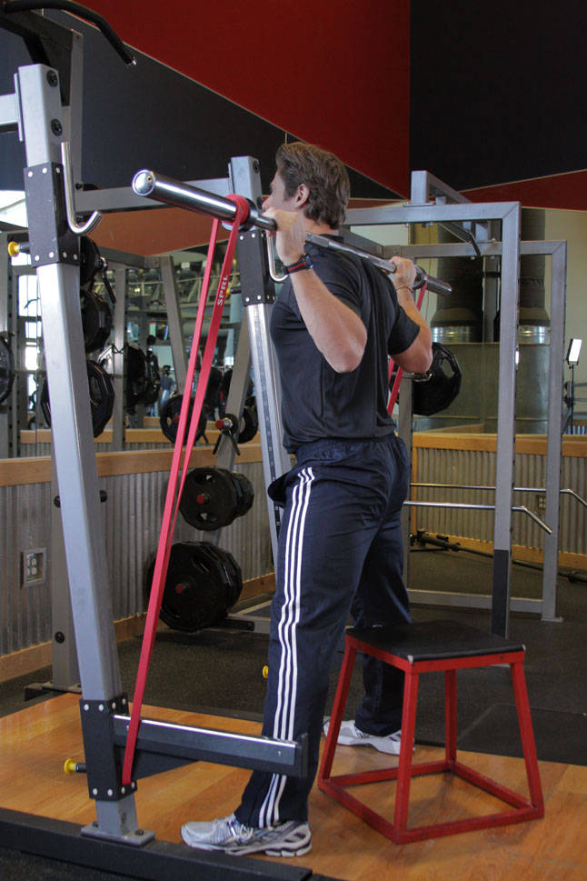 Demonstration of Speed Box Squat exercise showing proper form and technique