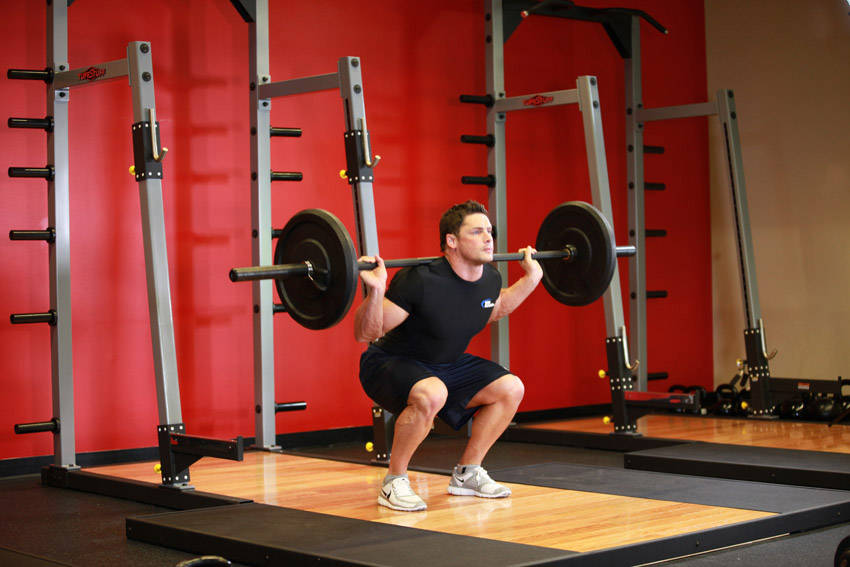 Demonstration of Speed Squats exercise showing proper form and technique