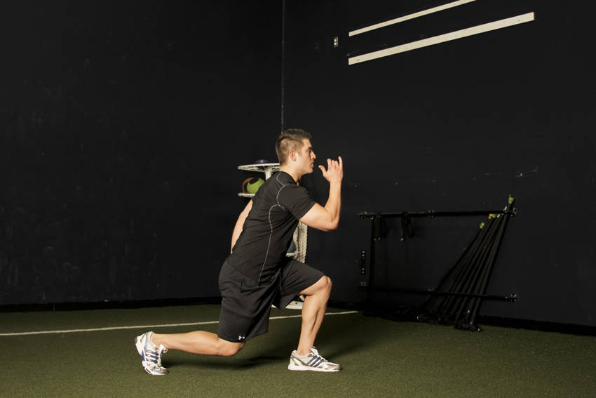 Demonstration of Split Jump exercise showing proper form and technique