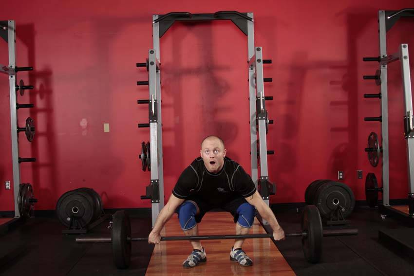 Demonstration of Split Snatch exercise showing proper form and technique