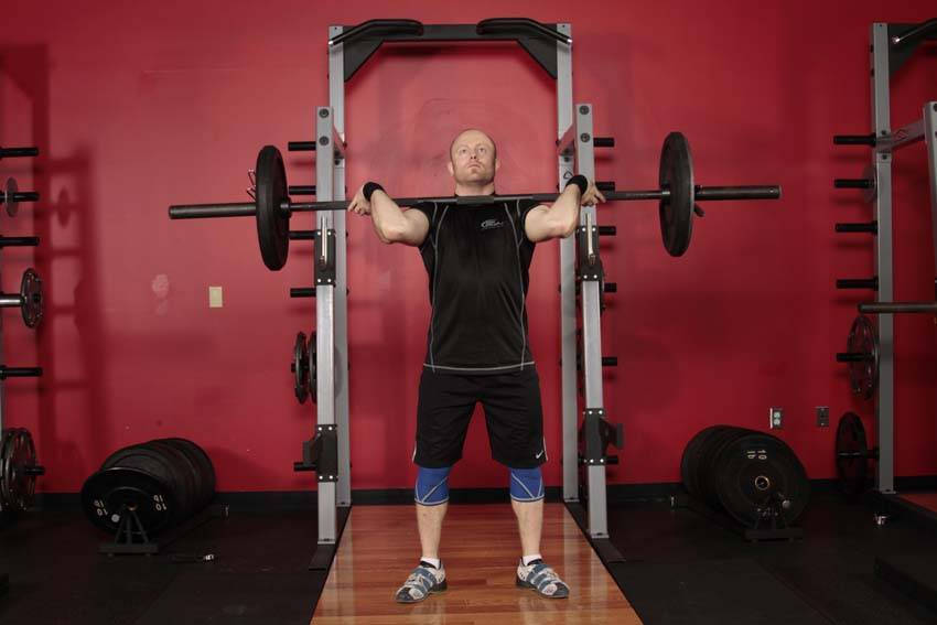 Demonstration of Squat Jerk exercise showing proper form and technique
