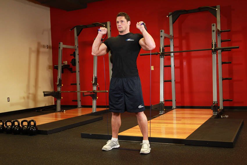 Demonstration of Squats - With Bands exercise showing proper form and technique