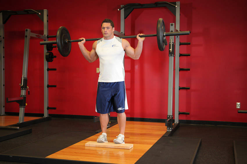 Alternative demonstration of Standing Barbell Calf Raise exercise