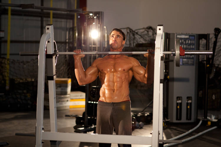 Demonstration of Standing Bradford Press exercise showing proper form and technique