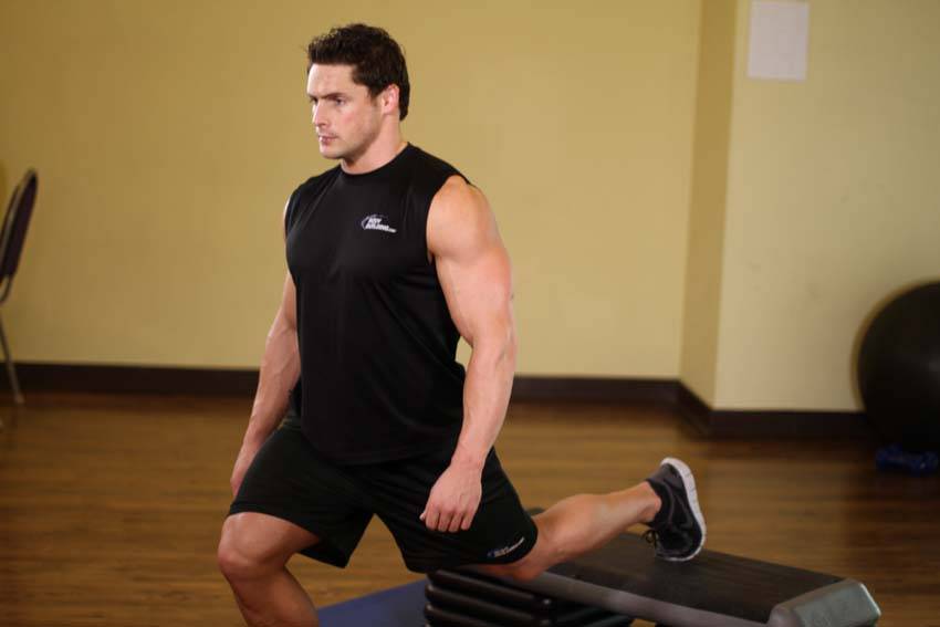 Alternative demonstration of Standing Elevated Quad Stretch exercise