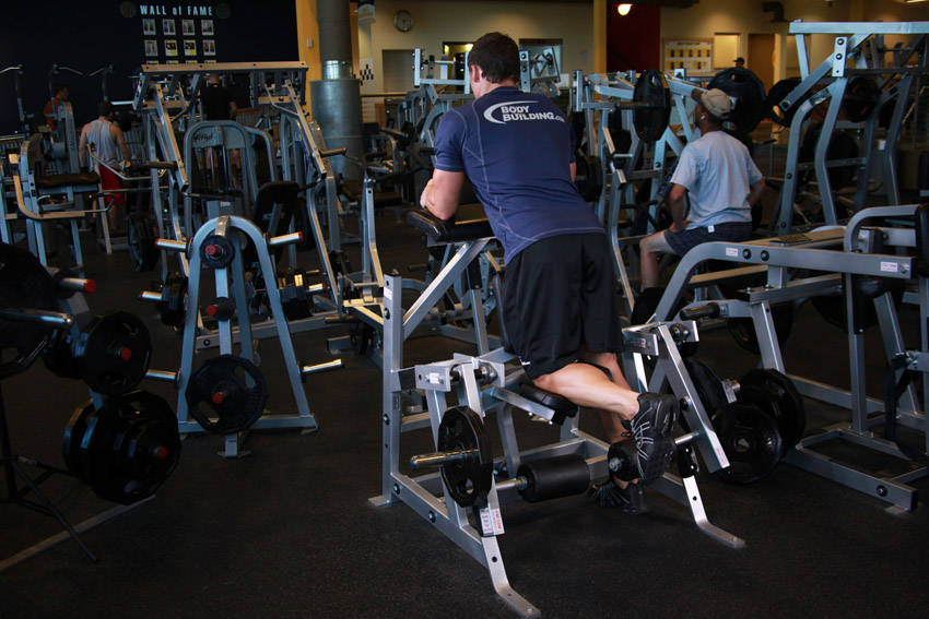 Demonstration of Standing Leg Curl exercise showing proper form and technique