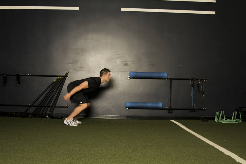 Demonstration of Standing Long Jump exercise showing proper form and technique