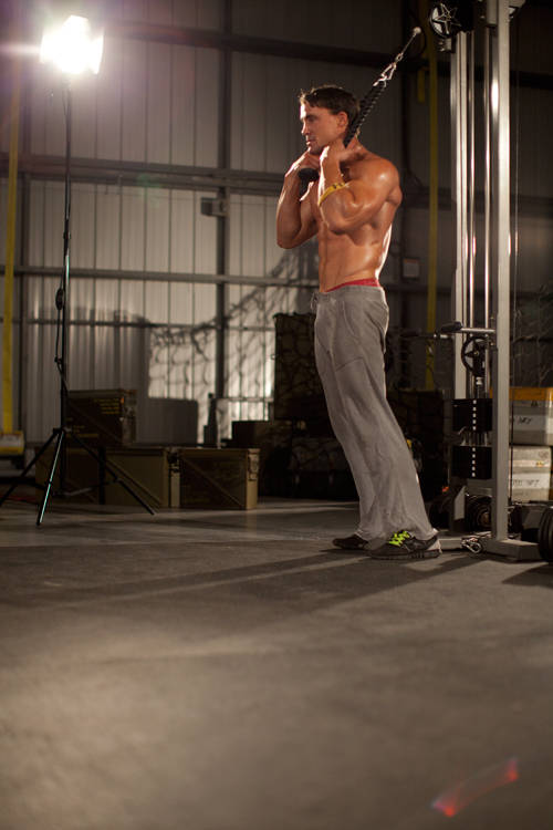 Demonstration of Standing Rope Crunch exercise showing proper form and technique