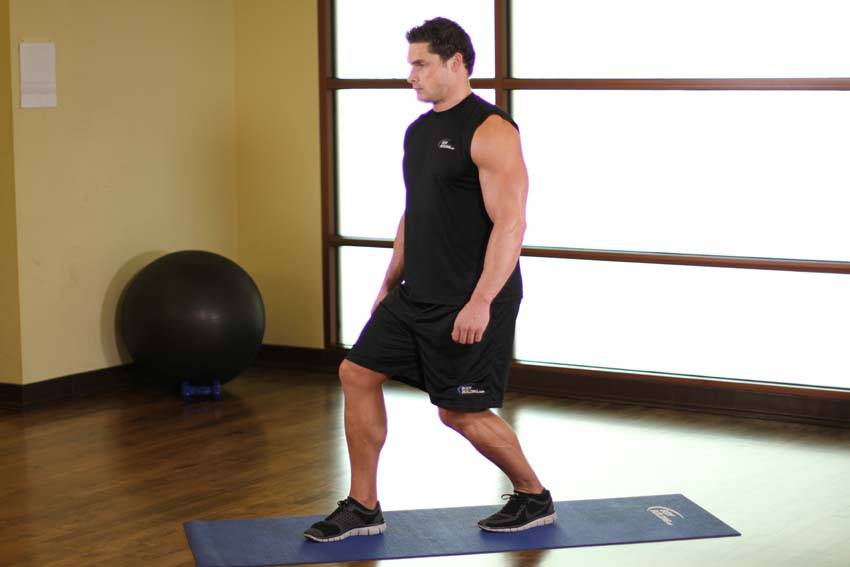 Demonstration of Standing Soleus And Achilles Stretch exercise showing proper form and technique