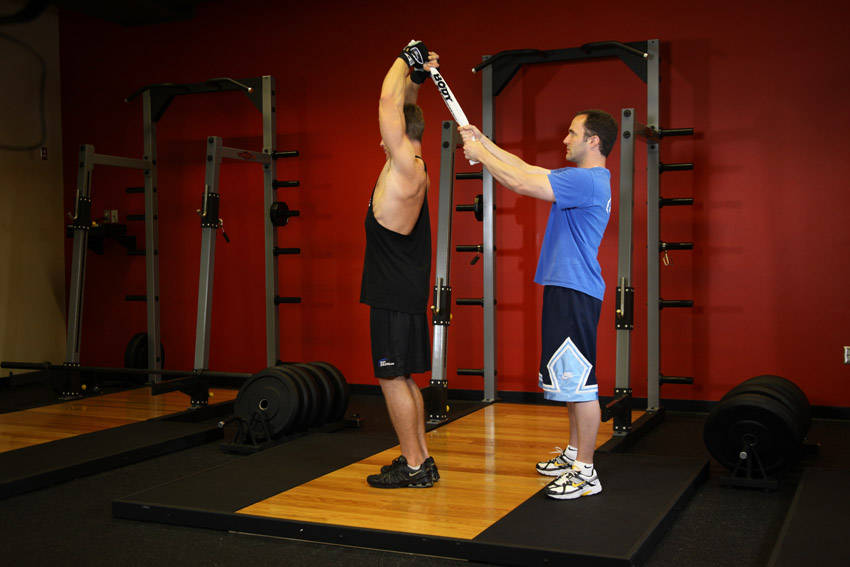 Alternative demonstration of Standing Towel Triceps Extension exercise