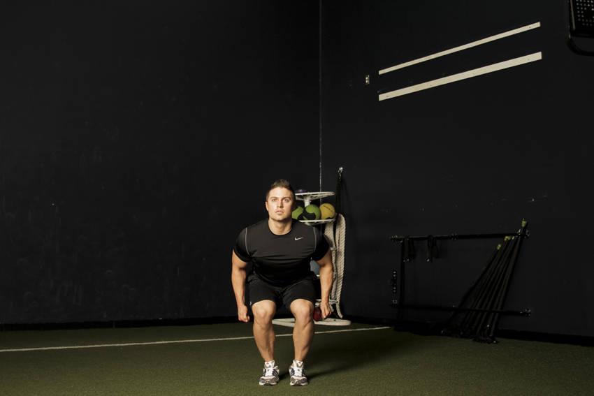 Demonstration of Star Jump exercise showing proper form and technique