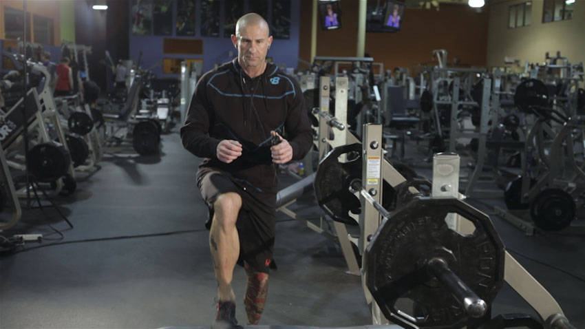 Demonstration of Step-up with Knee Raise exercise showing proper form and technique
