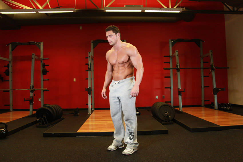 Demonstration of Stomach Vacuum exercise showing proper form and technique