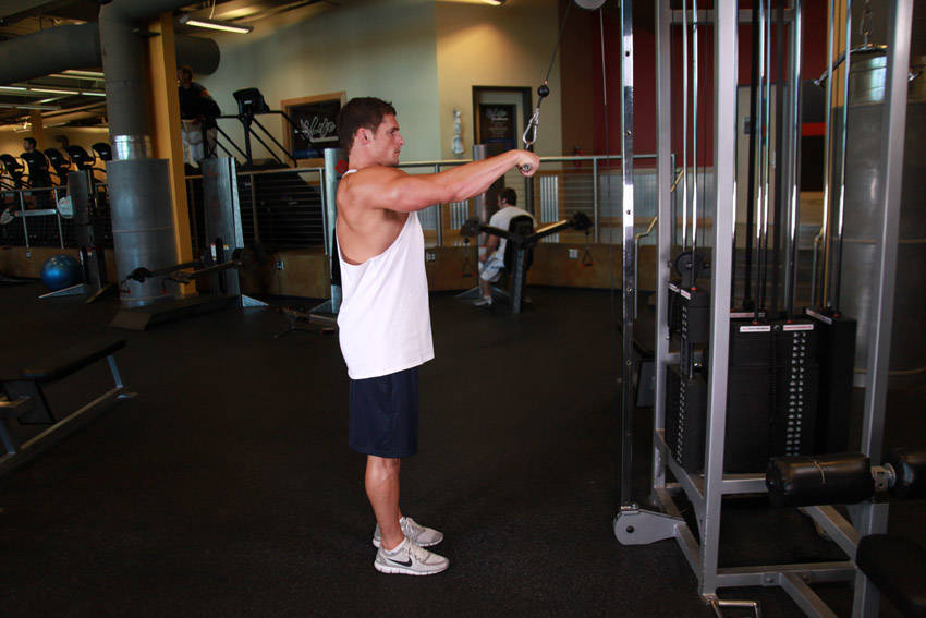 Demonstration of Straight-Arm Pulldown exercise showing proper form and technique