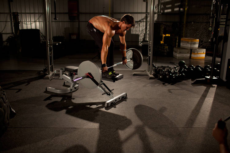 Demonstration of Straight Bar Bench Mid Rows exercise showing proper form and technique