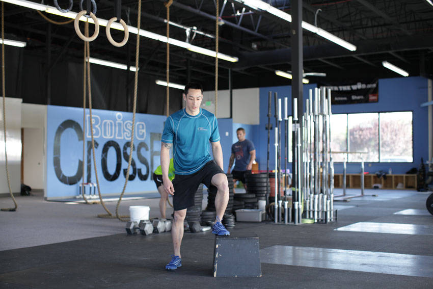 Demonstration of Stride Jump Crossover exercise showing proper form and technique