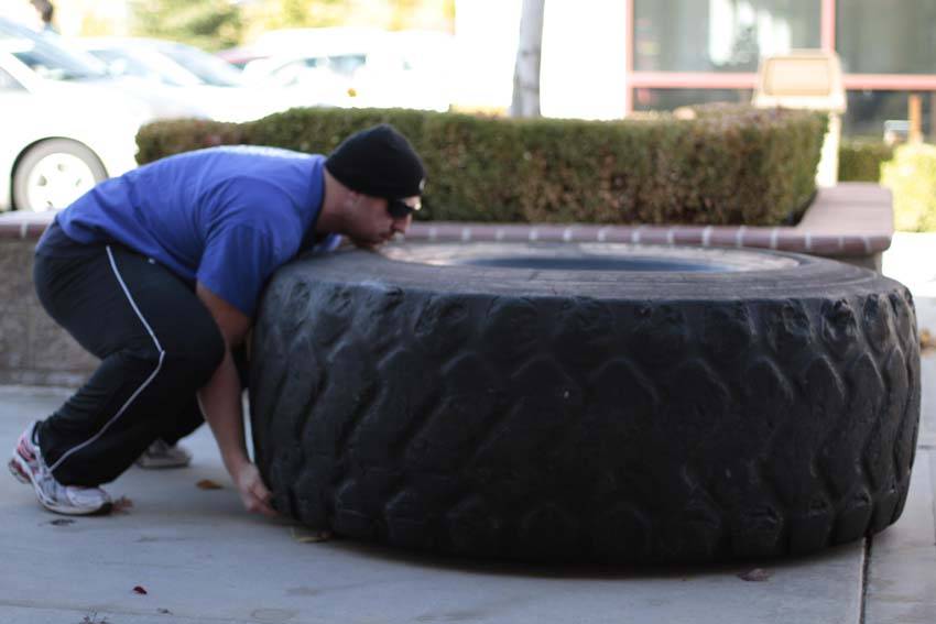 Demonstration of Tire Flip exercise showing proper form and technique