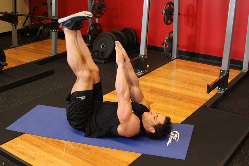 Demonstration of Toe Touchers exercise showing proper form and technique