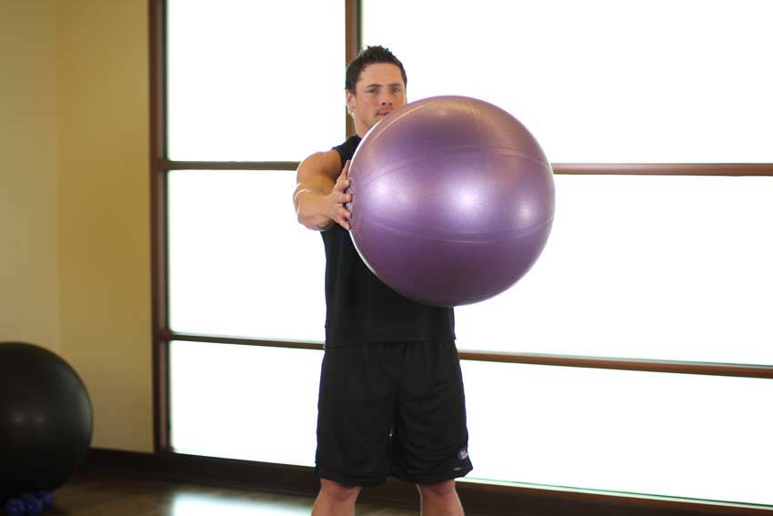 Demonstration of Torso Rotation exercise showing proper form and technique