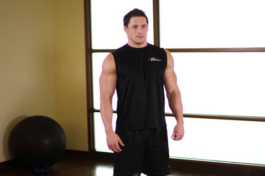 Demonstration of Tricep Side Stretch exercise showing proper form and technique