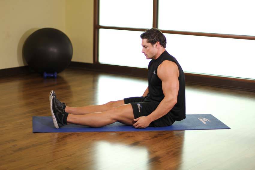 Demonstration of Upper Back-Leg Grab exercise showing proper form and technique