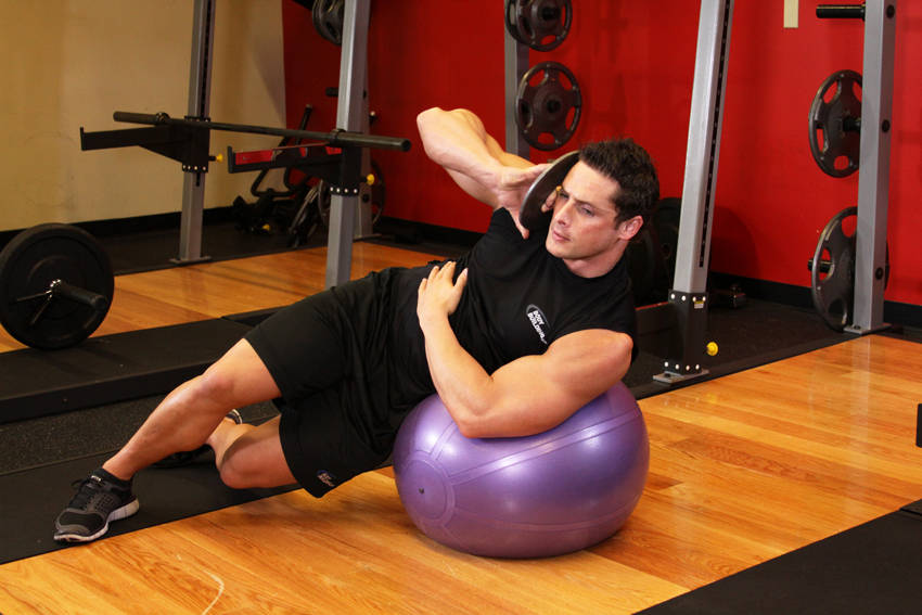 Alternative demonstration of Weighted Ball Side Bend exercise