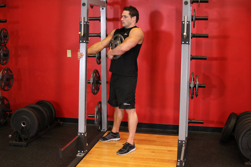 Demonstration of Weighted Sissy Squat exercise showing proper form and technique