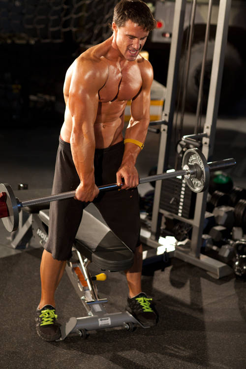 Demonstration of Wrist Rotations with Straight Bar exercise showing proper form and technique