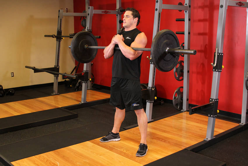 Demonstration of Zercher Squats exercise showing proper form and technique